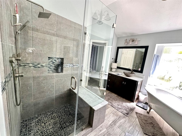 8910 Everhart Ln, Houston, TX 77040 - bathroom with a stall shower, vanity, vaulted ceiling, and a tub to relax in