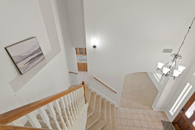 6426 Savannah Pines Dr, Katy, TX 77449 - staircase with a chandelier and tile patterned flooring