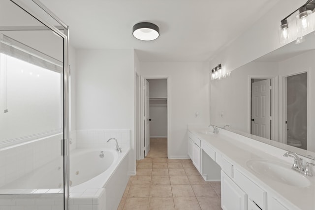 6426 Savannah Pines Dr, Katy, TX 77449 - full bath with a whirlpool tub, double vanity, toilet, and tile patterned flooring