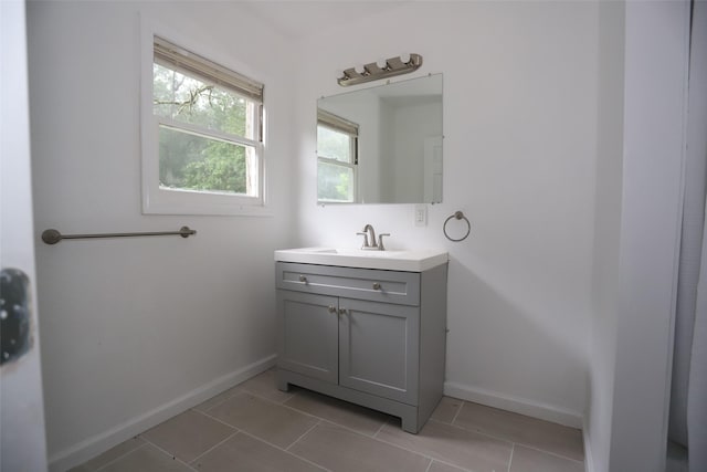 345 Byrd St, Vidor, TX 77662 - bathroom featuring vanity, baseboards, and tile patterned flooring