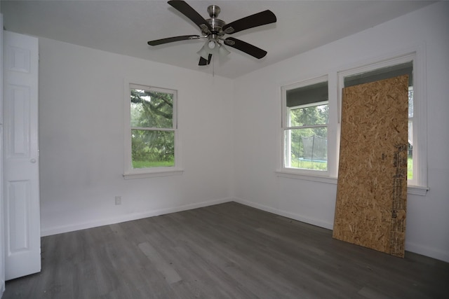 345 Byrd St, Vidor, TX 77662 - spare room featuring healthy amount of natural light, dark wood finished floors, a ceiling fan, and baseboards