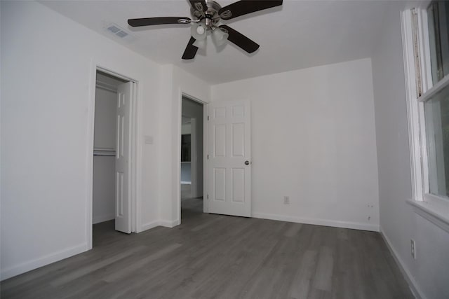 345 Byrd St, Vidor, TX 77662 - unfurnished bedroom with dark wood finished floors, baseboards, and a ceiling fan