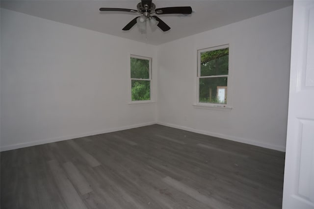 345 Byrd St, Vidor, TX 77662 - spare room with plenty of natural light, dark wood-style flooring, ceiling fan, and baseboards