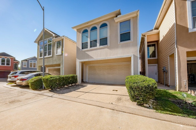 12510 Panther Place Dr, Houston, TX 77099 - view of front facade featuring a garage, stucco siding, and concrete driveway