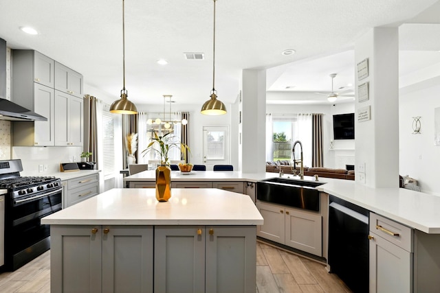 16522 N Canyon Trace Dr, Houston, TX 77095 - kitchen with gray cabinets, stainless steel gas range oven, a sink, dishwasher, and recessed lighting