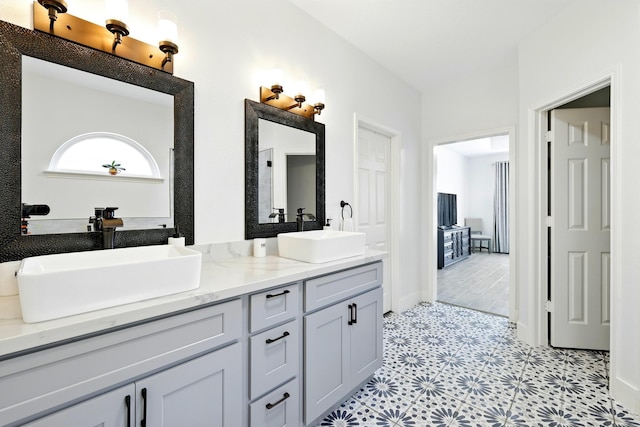 16522 N Canyon Trace Dr, Houston, TX 77095 - bathroom featuring double vanity, tile patterned floors, and baseboards