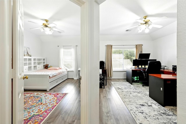 16522 N Canyon Trace Dr, Houston, TX 77095 - bedroom with an office area, wood finished floors, and ceiling fan