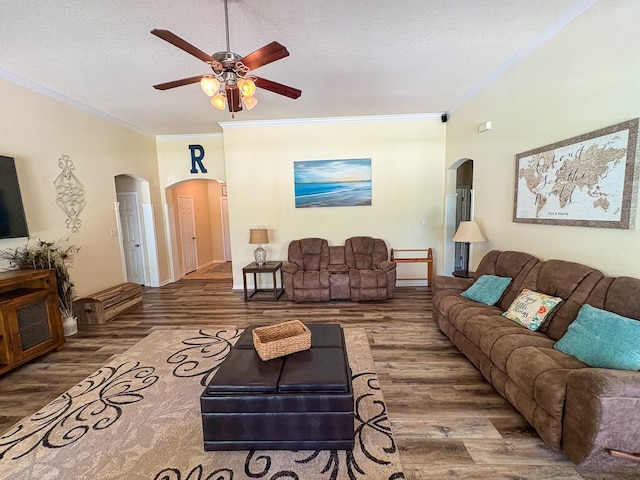 18 Joe Werner Ln, Huntsville, TX 77320 - living area with arched walkways, wood finished floors, ornamental molding, ceiling fan, and a textured ceiling