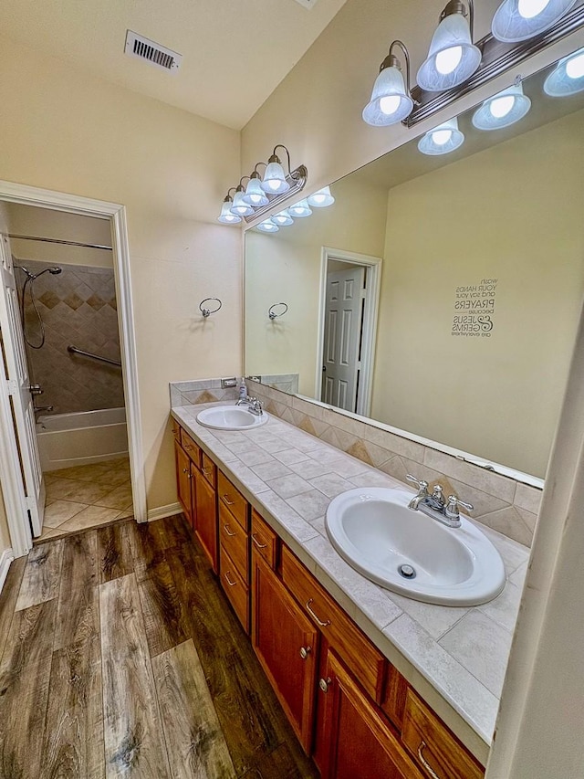 18 Joe Werner Ln, Huntsville, TX 77320 - full bath featuring double vanity, wood finished floors, and shower / bathtub combination