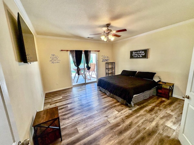 18 Joe Werner Ln, Huntsville, TX 77320 - bedroom featuring access to outside, wood finished floors, ornamental molding, a textured ceiling, and a ceiling fan