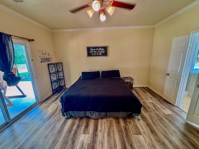 18 Joe Werner Ln, Huntsville, TX 77320 - bedroom featuring access to outside, wood finished floors, ornamental molding, baseboards, and a ceiling fan