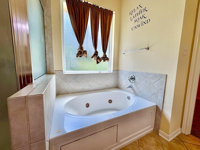 18 Joe Werner Ln, Huntsville, TX 77320 - bathroom featuring a jetted tub and tile patterned floors