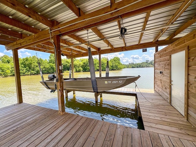 18 Joe Werner Ln, Huntsville, TX 77320 - dock area featuring boat lift, view of wooded area, and a water view