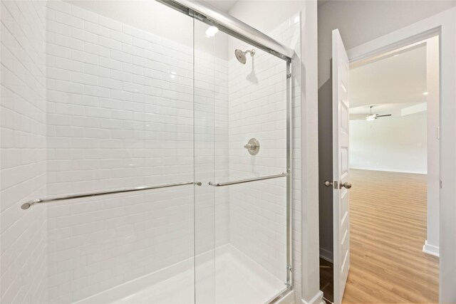 540 Barton Place Dr, Cleveland, TX 77327 - bathroom with wood finished floors and a shower stall