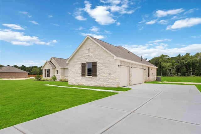 540 Barton Place Dr, Cleveland, TX 77327 - view of home's exterior featuring stone siding, a yard, driveway, and a garage
