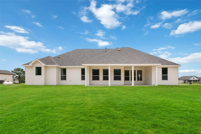 540 Barton Place Dr, Cleveland, TX 77327 - back of house with a lawn and a shingled roof