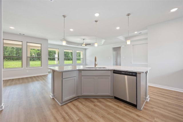 540 Barton Place Dr, Cleveland, TX 77327 - kitchen featuring dishwasher, a sink, open floor plan, light wood-type flooring, and recessed lighting