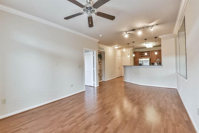 1711 Old Spanish Trl Unit 406, Houston, TX 77054 - unfurnished living room with light wood-type flooring, a ceiling fan, baseboards, and crown molding