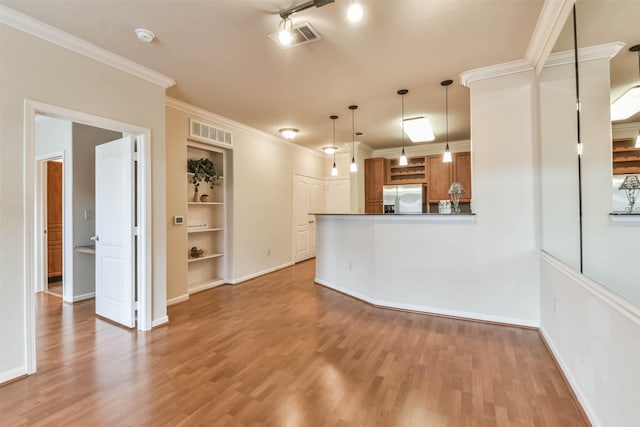 1711 Old Spanish Trl Unit 406, Houston, TX 77054 - unfurnished living room with wood finished floors, baseboards, crown molding, and built in features