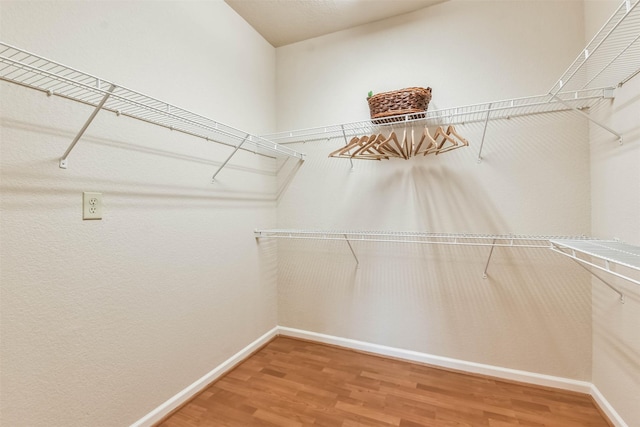 1711 Old Spanish Trl Unit 406, Houston, TX 77054 - walk in closet featuring wood finished floors