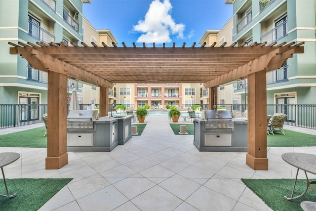 1711 Old Spanish Trl Unit 406, Houston, TX 77054 - view of patio featuring a pergola