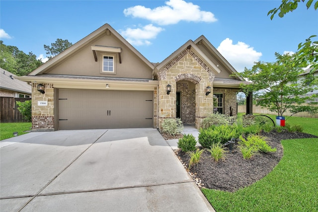 1586 Ancient Oak Ln, Conroe, TX 77301 - french provincial home with stucco siding, stone siding, driveway, and a garage