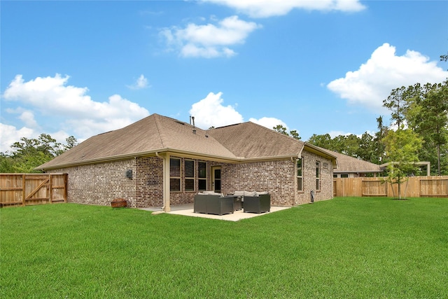 1586 Ancient Oak Ln, Conroe, TX 77301 - rear view of house with brick siding, outdoor lounge area, a fenced backyard, and a patio