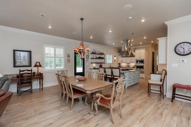 5950 Keith Rd, Lumberton, TX 77657 - dining space with a chandelier, crown molding, light wood-type flooring, and recessed lighting