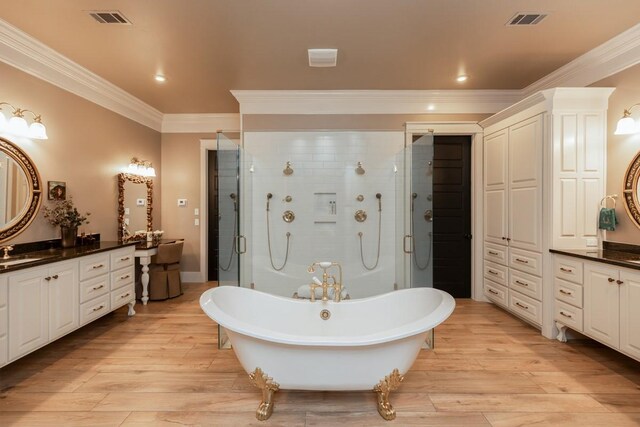 5950 Keith Rd, Lumberton, TX 77657 - full bathroom featuring crown molding, wood finished floors, vanity, a soaking tub, and a shower stall