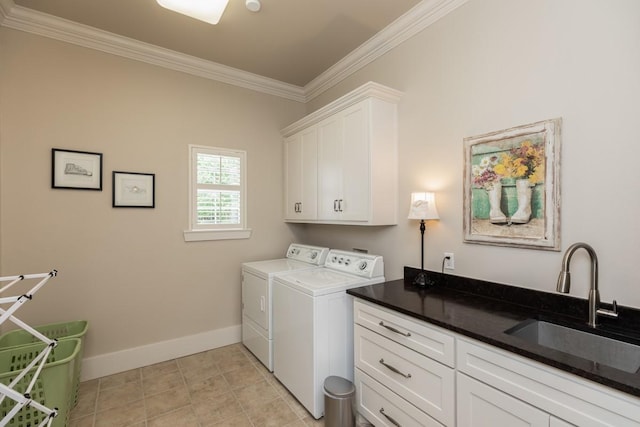 5950 Keith Rd, Lumberton, TX 77657 - laundry area featuring cabinet space, washer and clothes dryer, ornamental molding, and baseboards