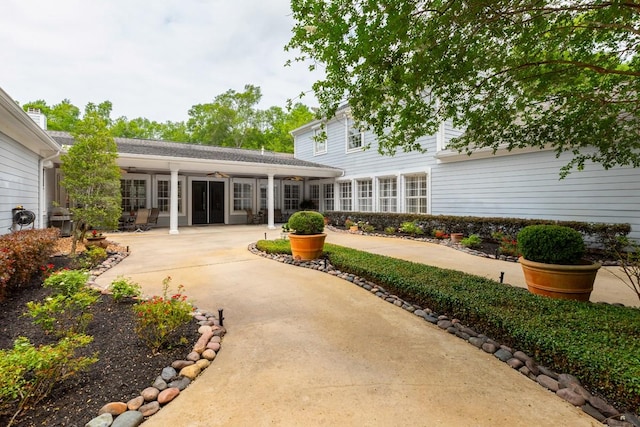 5950 Keith Rd, Lumberton, TX 77657 - rear view of house featuring ceiling fan and a patio area