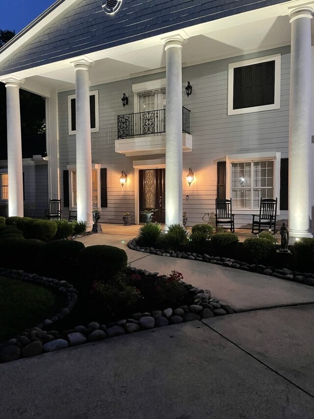 5950 Keith Rd, Lumberton, TX 77657 - view of front of house with a balcony and a porch