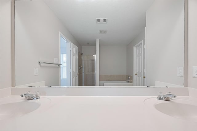 1219 Newsome Glenn Dr, Houston, TX 77090 - bathroom with a bath, a stall shower, and vanity