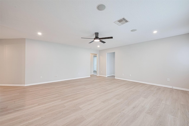 1219 Newsome Glenn Dr, Houston, TX 77090 - empty room featuring light wood-type flooring, ceiling fan, baseboards, and recessed lighting