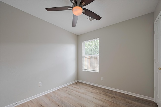 1219 Newsome Glenn Dr, Houston, TX 77090 - empty room with light wood-style floors, ceiling fan, baseboards, and vaulted ceiling