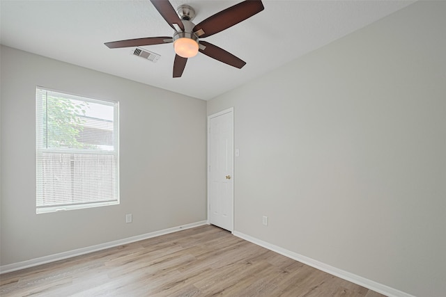 1219 Newsome Glenn Dr, Houston, TX 77090 - unfurnished room featuring light wood-style flooring, a ceiling fan, and baseboards