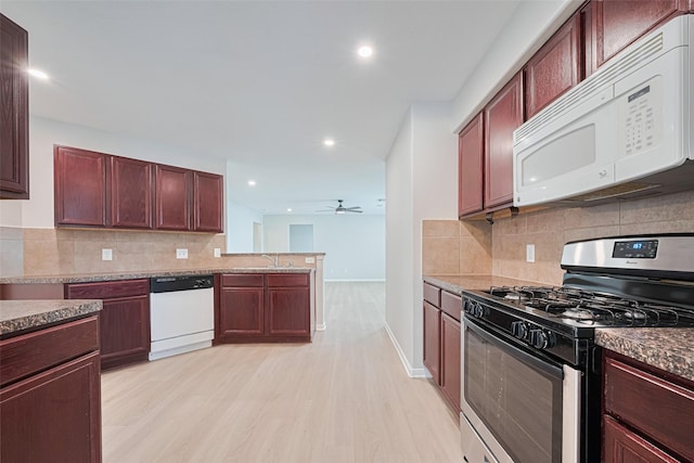 1219 Newsome Glenn Dr, Houston, TX 77090 - kitchen featuring white appliances, light wood-style flooring, a sink, ceiling fan, and tasteful backsplash