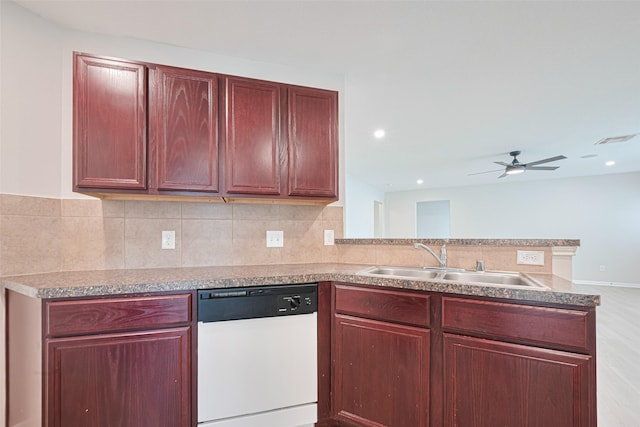 1219 Newsome Glenn Dr, Houston, TX 77090 - kitchen with white dishwasher, a sink, a peninsula, and reddish brown cabinets