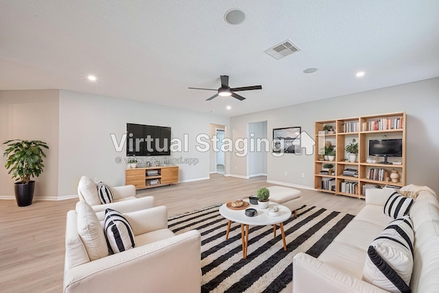 1219 Newsome Glenn Dr, Houston, TX 77090 - living area featuring light wood-style floors, a ceiling fan, baseboards, and recessed lighting