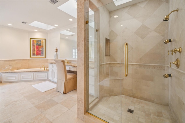 2214 Potomac Dr Unit 2, Houston, TX 77057 - full bathroom with a skylight, a bath, a shower stall, tile walls, and recessed lighting