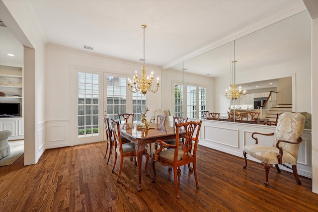 2214 Potomac Dr Unit 2, Houston, TX 77057 - dining room with a decorative wall, a chandelier, wood finished floors, crown molding, and stairs