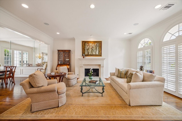 2214 Potomac Dr Unit 2, Houston, TX 77057 - living room featuring healthy amount of natural light, crown molding, wood finished floors, recessed lighting, and a chandelier