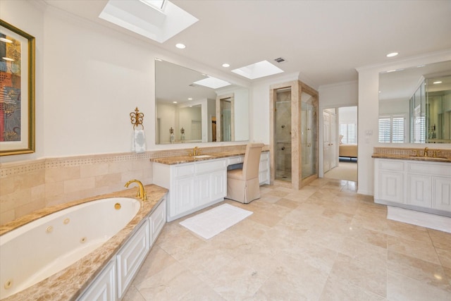 2214 Potomac Dr Unit 2, Houston, TX 77057 - bathroom featuring a skylight, ornamental molding, a whirlpool tub, two vanities, and a stall shower