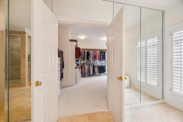 2214 Potomac Dr Unit 2, Houston, TX 77057 - hall with plenty of natural light, light tile patterned floors, and baseboards