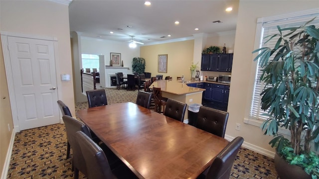 2100 Welch St Unit C305, Houston, TX 77019 - dining room featuring baseboards, recessed lighting, ceiling fan, and crown molding