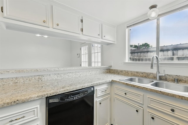 2079 Country Village Blvd Unit C, Humble, TX 77338 - kitchen featuring black dishwasher, a sink, healthy amount of natural light, and white cabinets