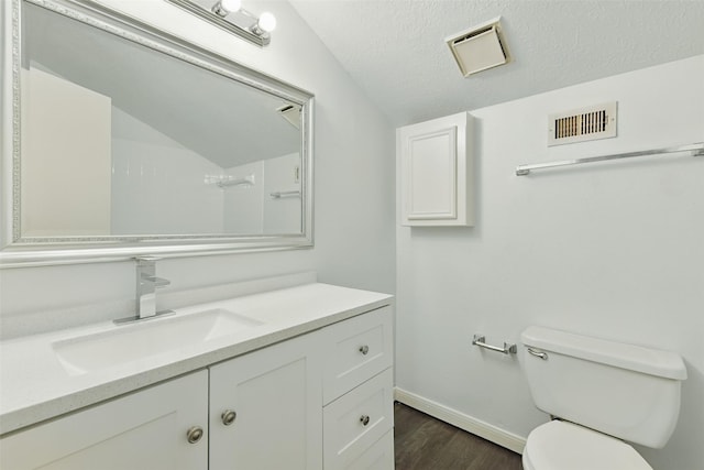 2079 Country Village Blvd Unit C, Humble, TX 77338 - bathroom with toilet, vanity, wood finished floors, baseboards, and a textured ceiling