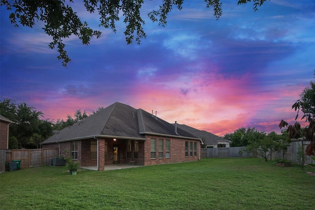27910 Wedgeoak Ct, Katy, TX 77494 - back of property with brick siding, a patio area, and a shingled roof