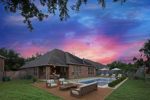 27910 Wedgeoak Ct, Katy, TX 77494 - back of house at dusk with brick siding, a wooden deck, an outdoor living space, and cooling unit