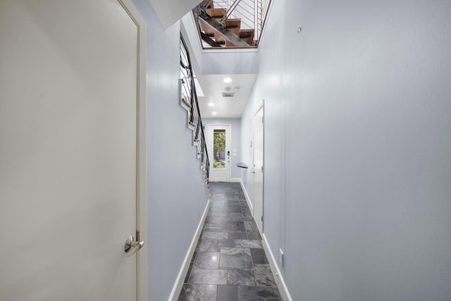 1822 Brun St, Houston, TX 77019 - corridor featuring baseboards, recessed lighting, stairs, and dark marble finish flooring